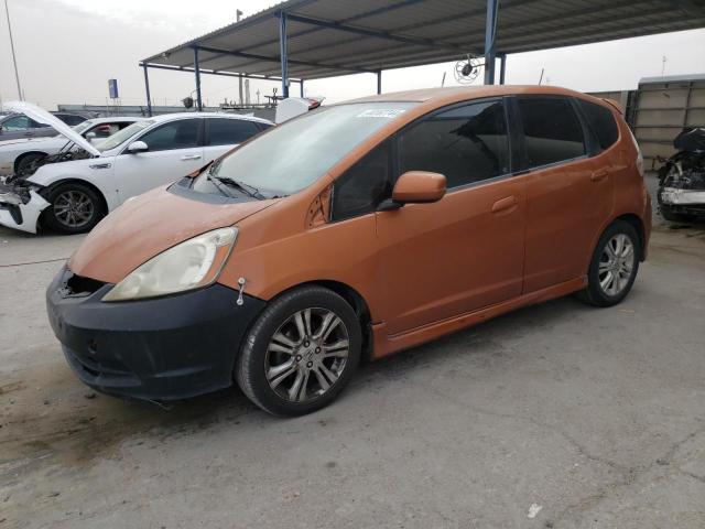 JHMGE8H46AS027987 - 2010 HONDA FIT SPORT ORANGE photo 1