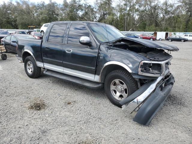 1FTRW07L41KE64307 - 2001 FORD F150 SUPERCREW BLACK photo 4