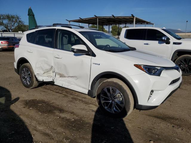 JTMRJREV6GD050689 - 2016 TOYOTA RAV4 HV XLE WHITE photo 4