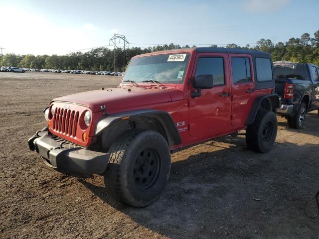 1J4GB39199L723647 - 2009 JEEP WRANGLER U X RED photo 1