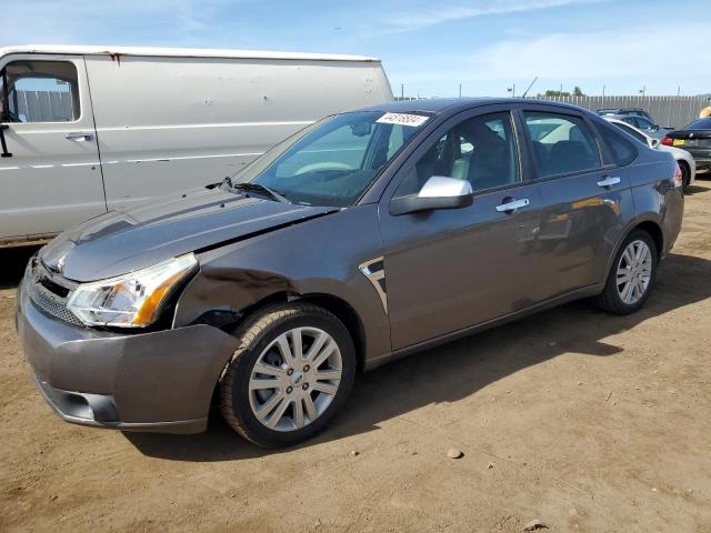 1FAHP37N29W199909 - 2009 FORD FOCUS SEL GRAY photo 1