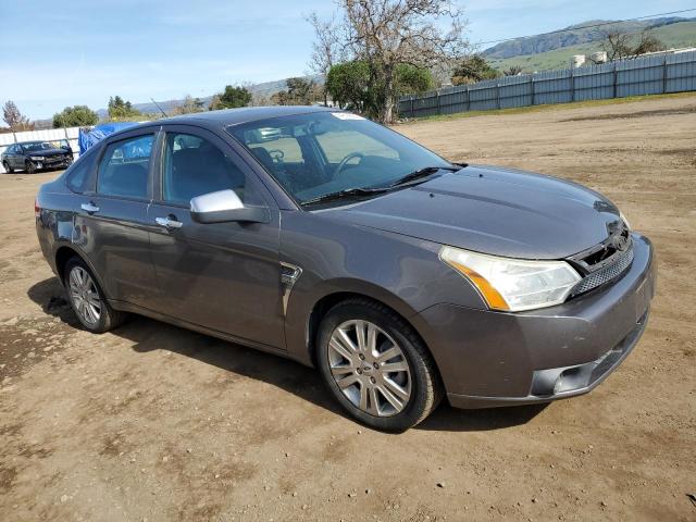 1FAHP37N29W199909 - 2009 FORD FOCUS SEL GRAY photo 4