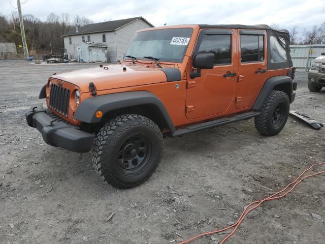 1J4HA3H1XAL211036 - 2010 JEEP WRANGLER U SPORT ORANGE photo 1