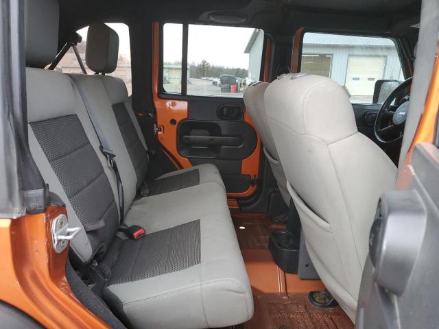 1J4HA3H1XAL211036 - 2010 JEEP WRANGLER U SPORT ORANGE photo 11