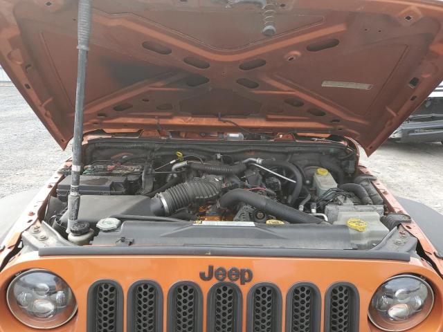 1J4HA3H1XAL211036 - 2010 JEEP WRANGLER U SPORT ნარინჯისფერი ფოტო 12