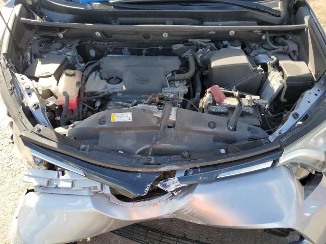 2T3ZFREV6JW505391 - 2018 TOYOTA RAV4 LE SILVER photo 11