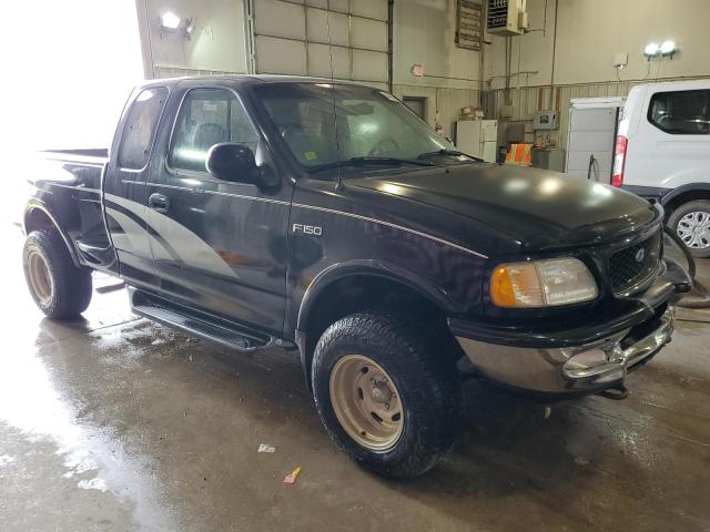 1FTEX08LXVKC69974 - 1997 FORD F150 BLACK photo 4