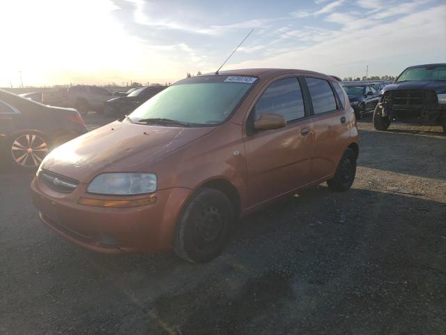 KL1TD62675B458496 - 2005 CHEVROLET AVEO BASE ORANGE photo 1