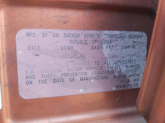 KL1TD62675B458496 - 2005 CHEVROLET AVEO BASE ORANGE photo 12