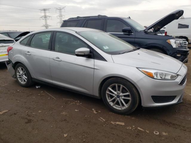 1FADP3F21FL301686 - 2015 FORD FOCUS SE SILVER photo 4