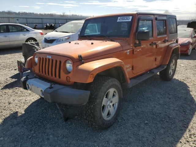 1J4HA5H15BL555144 - 2011 JEEP WRANGLER U SAHARA ORANGE photo 1