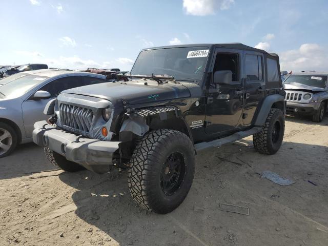 1J4HA3H19BL515301 - 2011 JEEP WRANGLER U SPORT BLACK photo 1