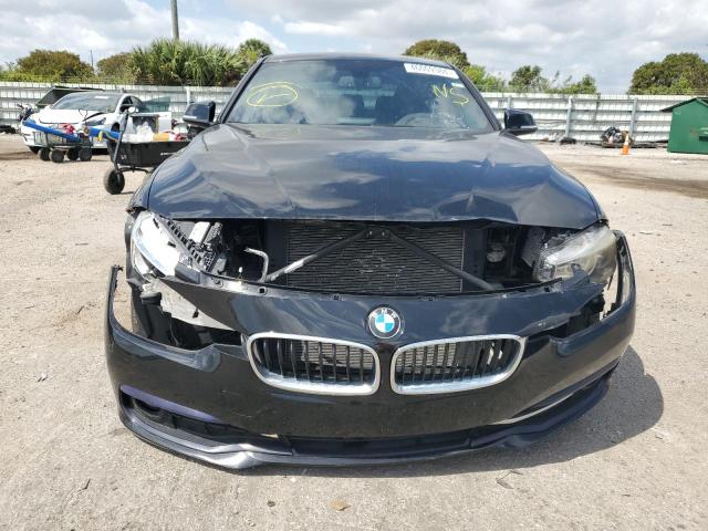 WBA8D9C5XJEM33748 - 2018 BMW 330 XI BLACK photo 5