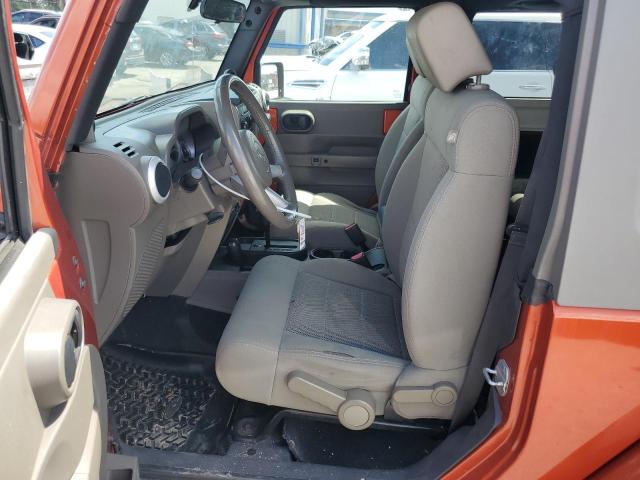 1J4FA54139L745077 - 2009 JEEP WRANGLER SAHARA ORANGE photo 7