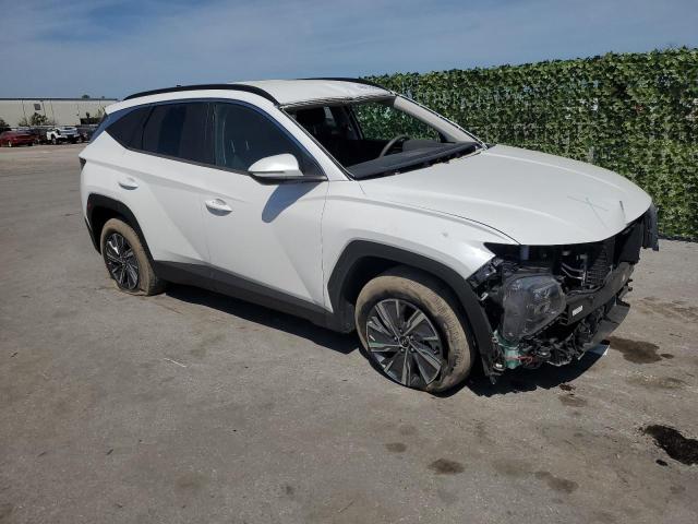 KM8JBCA13NU018818 - 2022 HYUNDAI TUCSON BLUE WHITE photo 4