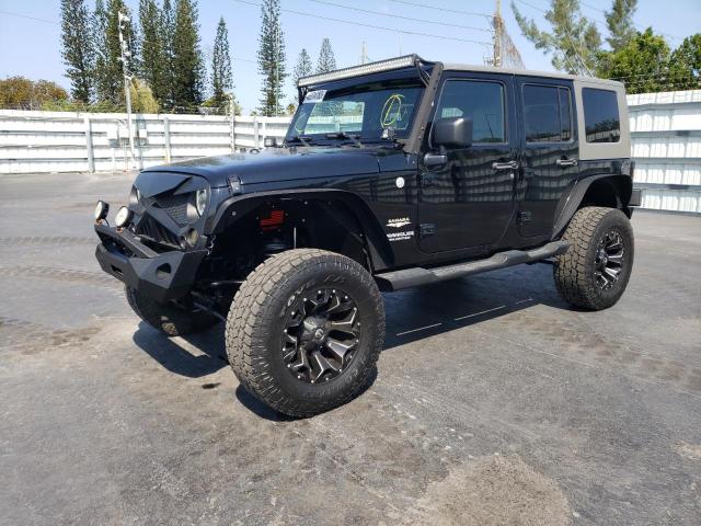 1J4HA5H17AL156590 - 2010 JEEP WRANGLER U SAHARA BLACK photo 1