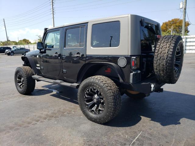 1J4HA5H17AL156590 - 2010 JEEP WRANGLER U SAHARA BLACK photo 2
