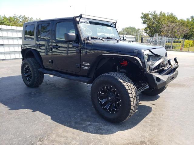 1J4HA5H17AL156590 - 2010 JEEP WRANGLER U SAHARA BLACK photo 4