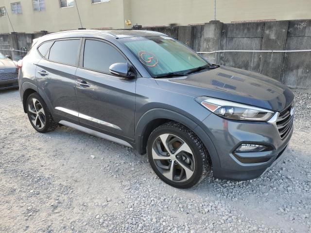 KM8J33A2XJU640865 - 2018 HYUNDAI TUCSON VALUE GRAY photo 4