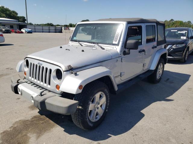 1J4HA5H10AL115427 - 2010 JEEP WRANGLER U SAHARA SILVER photo 1