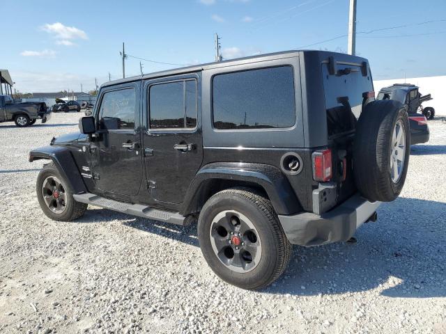 1J4BA5H16BL548869 - 2011 JEEP WRANGLER U SAHARA BLACK photo 2