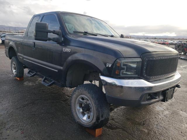 1FTNX21FXXEB22832 - 1999 FORD F250 SUPER DUTY BLACK photo 4