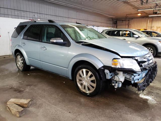 1FMDK03W28GA12581 - 2008 FORD TAURUS X LIMITED BLUE photo 4