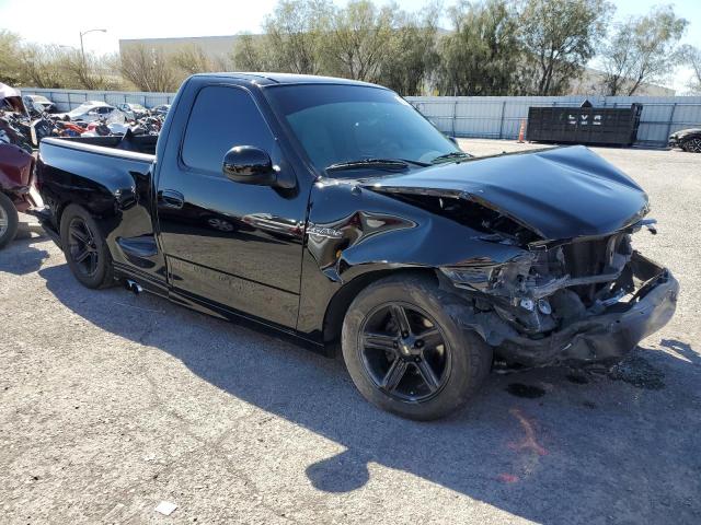 2FTZF07322CA65045 - 2002 FORD F150 SVT LIGHTNING BLACK photo 4