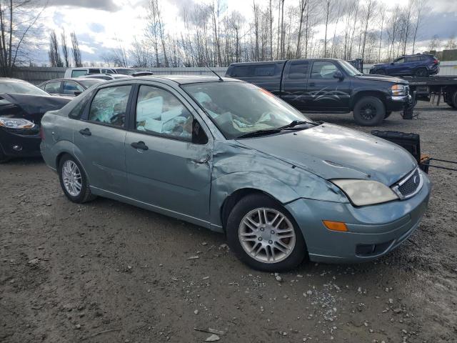 1FAFP34N85W164149 - 2005 FORD FOCUS ZX4 GREEN photo 4