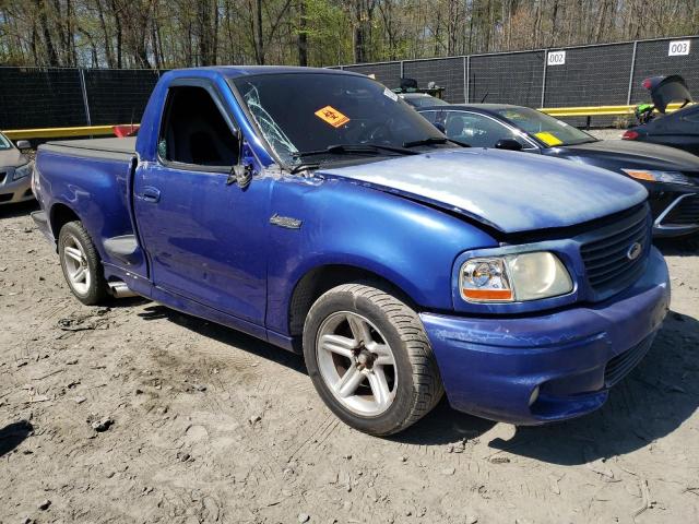 2FTRF07304CA59084 - 2004 FORD F150 SVT LIGHTNING BLUE photo 4