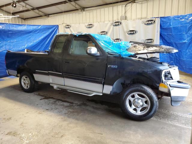 1FTDX176XVND43986 - 1997 FORD F150 BLACK photo 4