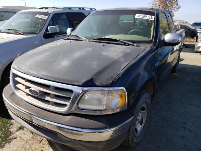 1FTZX1720YKB47029 - 2000 FORD F-150 BLACK photo 1