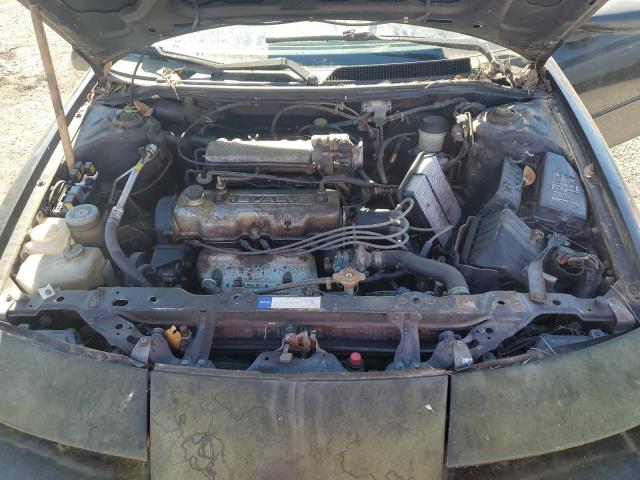 J81RF2365L7578670 - 1990 GEO STORM 2+2 Schwarz Foto 11