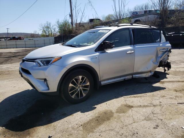 JTMRJREV7GD013120 - 2016 TOYOTA RAV4 HV XLE SILVER photo 1