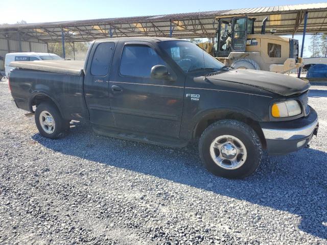 1FTRX18L6XNB76197 - 1999 FORD F150 BLACK photo 4