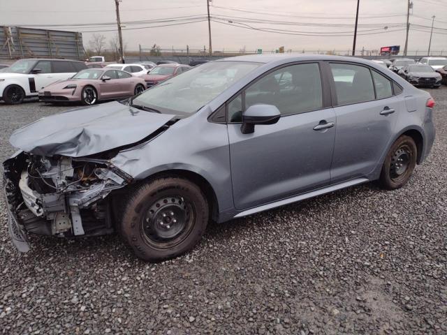 5YFEPMAE6MP245058 - 2021 TOYOTA COROLLA LE SILVER photo 1