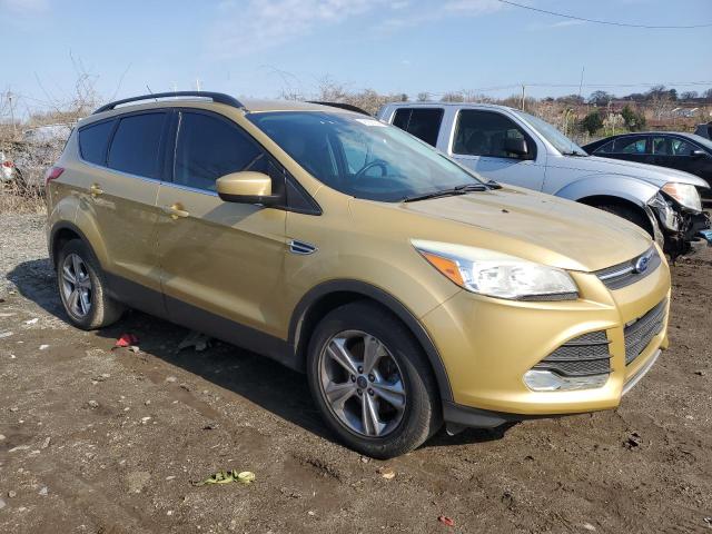 1FMCU9G94FUC28896 - 2015 FORD ESCAPE SE GOLD photo 4