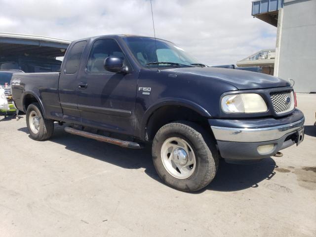 1FTRX18L4YNA98536 - 2000 FORD F150 BLUE photo 4