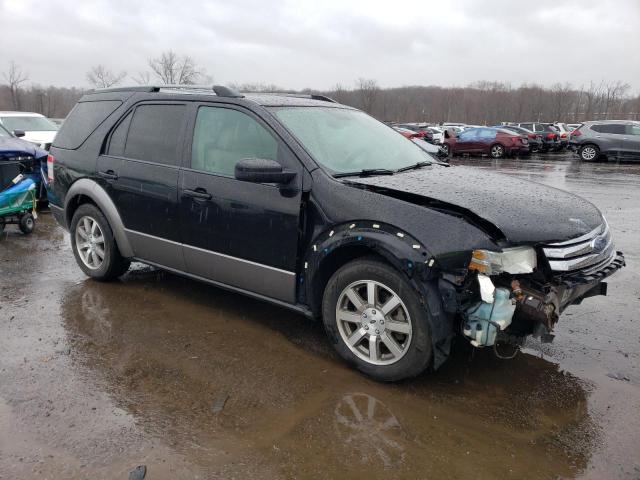 1FMDK05W58GA06612 - 2008 FORD TAURUS X SEL BLACK photo 4