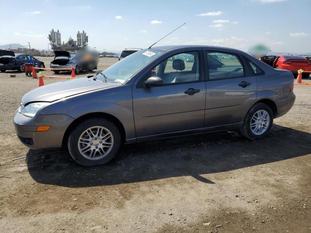 1FAFP34NX7W217985 - 2007 FORD FOCUS ZX4 GRAY photo 1