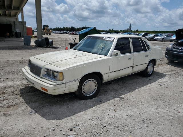 1P3BJ46KXHC319423 - 1987 PLYMOUTH CARAVELLE SE WHITE photo 1