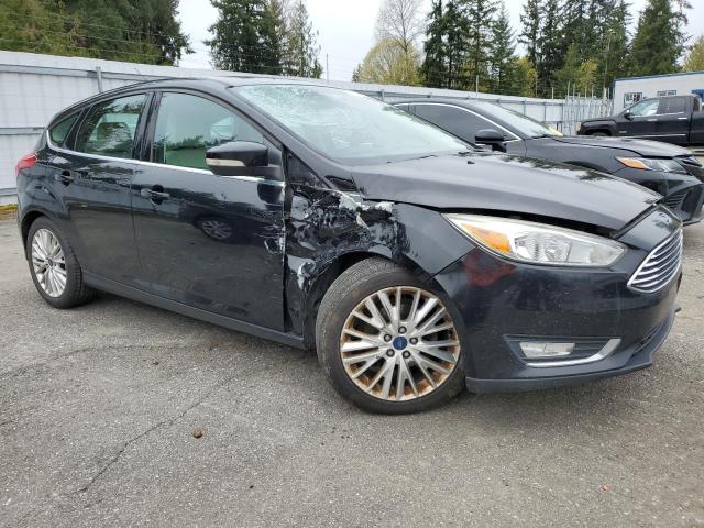 1FADP3N29GL222592 - 2016 FORD FOCUS TITANIUM BLACK photo 4