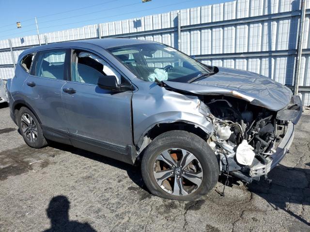 2HKRW5H32KH422178 - 2019 HONDA CR-V LX SILVER photo 4