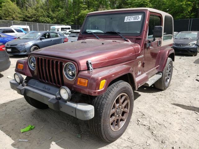 1J4FA59S42P742107 - 2002 JEEP WRANGLER / SAHARA BURGUNDY photo 1