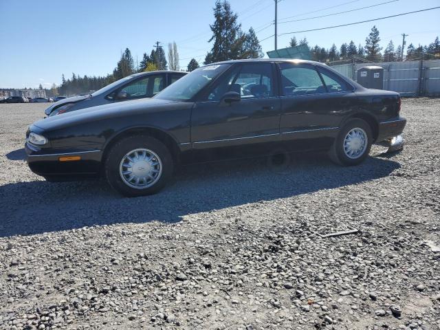 1G3HN52K6W4824506 - 1998 OLDSMOBILE 88 BASE BLACK photo 1