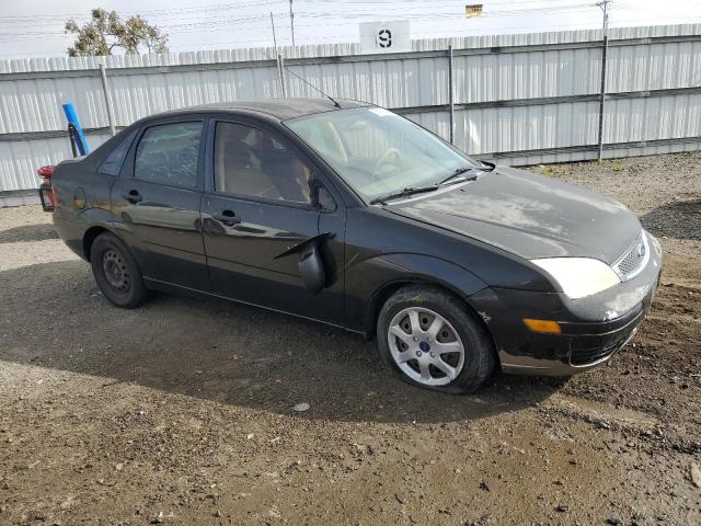 1FAFP34N65W207628 - 2005 FORD FOCUS ZX4 BLACK photo 4