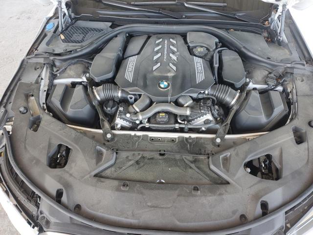 WBAGV8C03MCF46807 - 2021 BMW M850XI WHITE photo 11