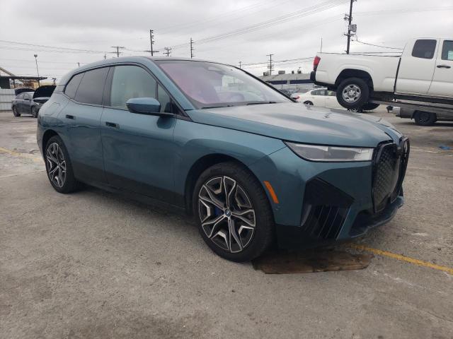 WB523CF07RCR72663 - 2024 BMW IX XDRIVE50 TEAL photo 4