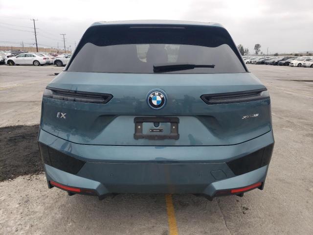 WB523CF07RCR72663 - 2024 BMW IX XDRIVE50 TEAL photo 6