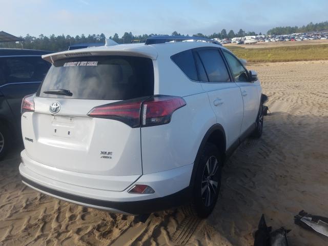 JTMRFREV9JD254377 - 2018 TOYOTA RAV4 ADVENTURE WHITE photo 4